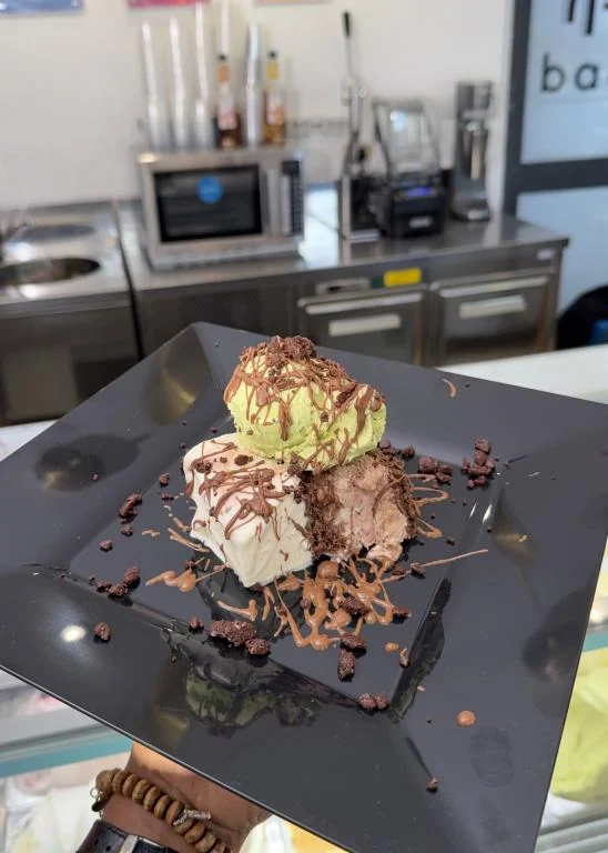 Gelato scoops, plated with chocolate