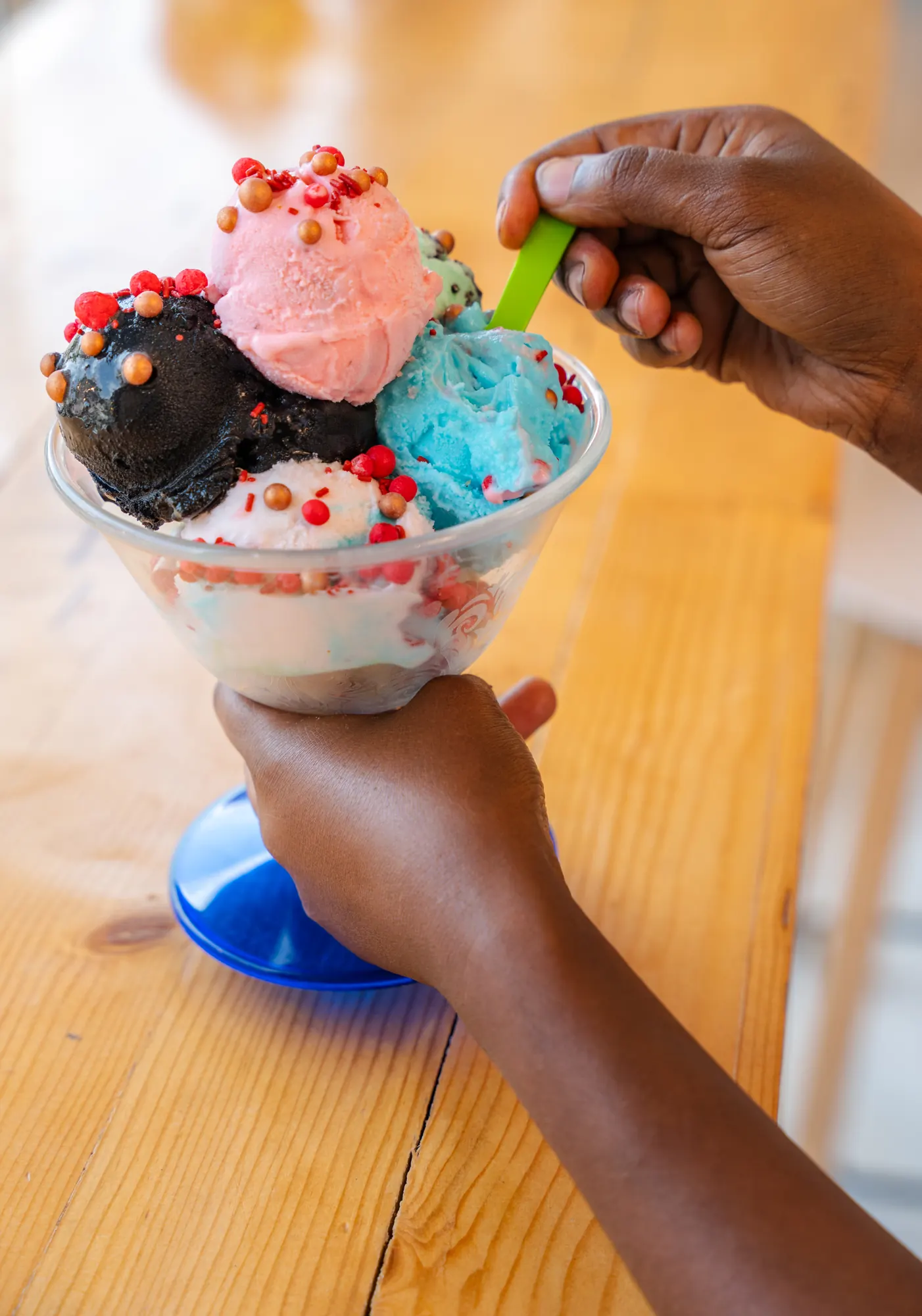 A five-scoop sundae finished with sprinkles and sugar pearls