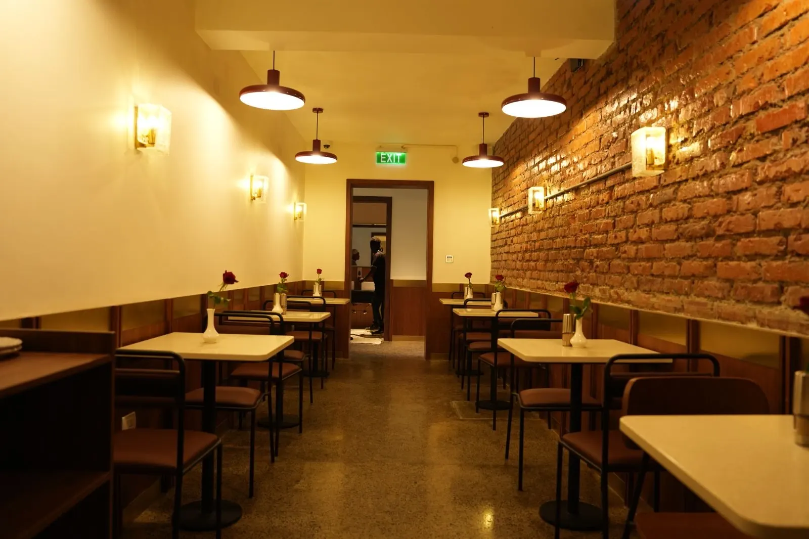 Romina dining room, brick wall and pendant lights