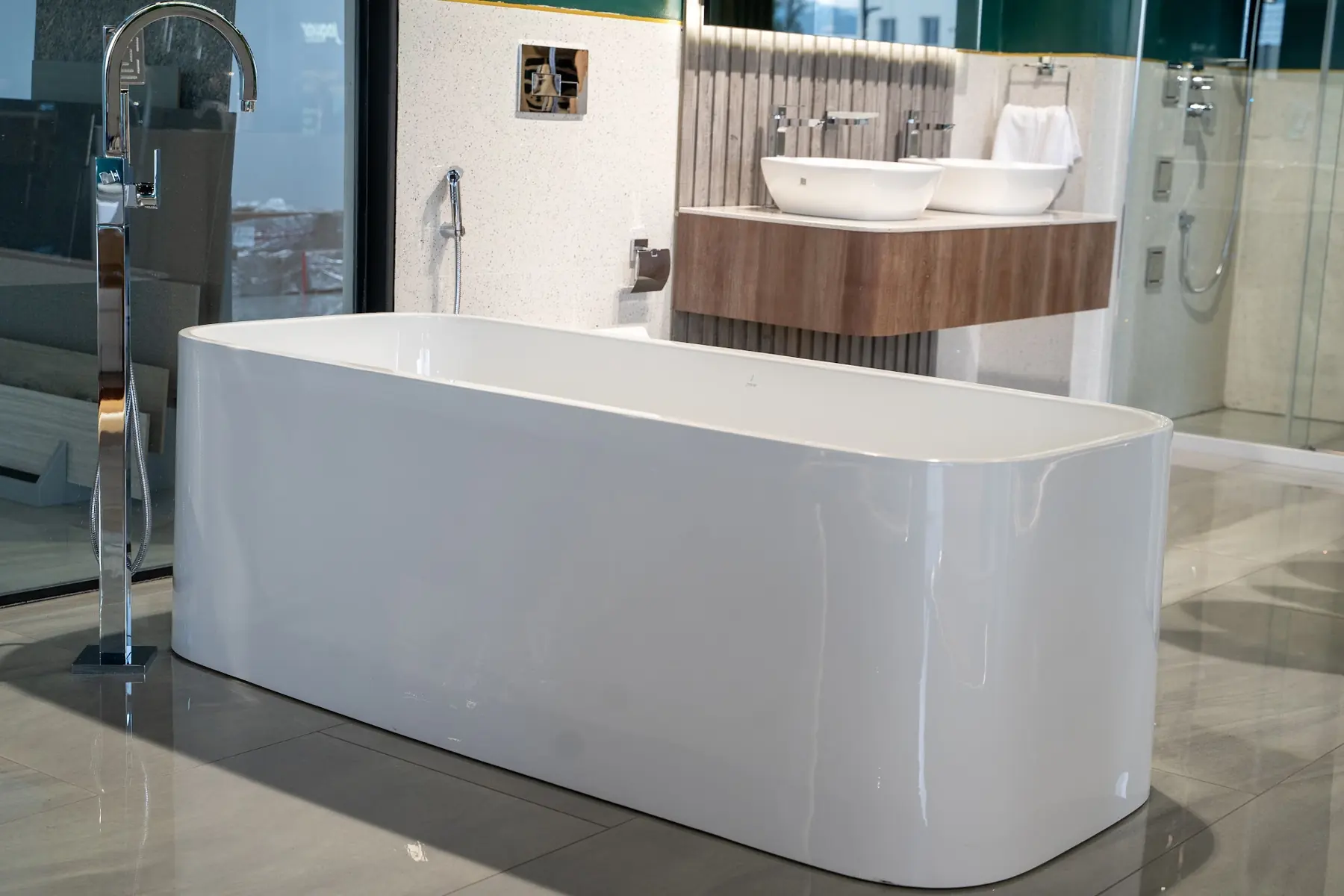 A freestanding bathtub with a floor-mounted filler