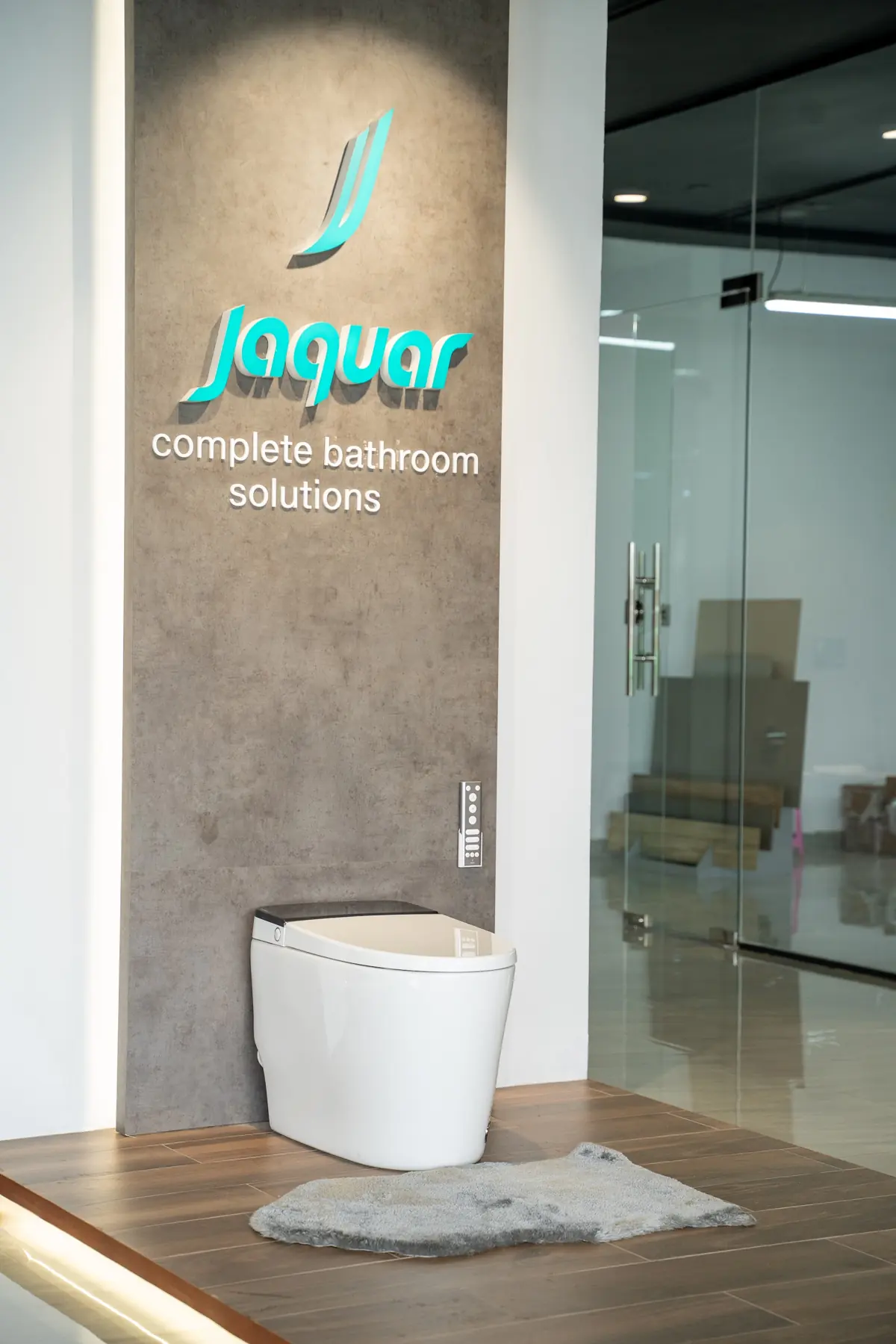 The Jaquar brand wall in the showroom: complete bathroom and lighting solutions