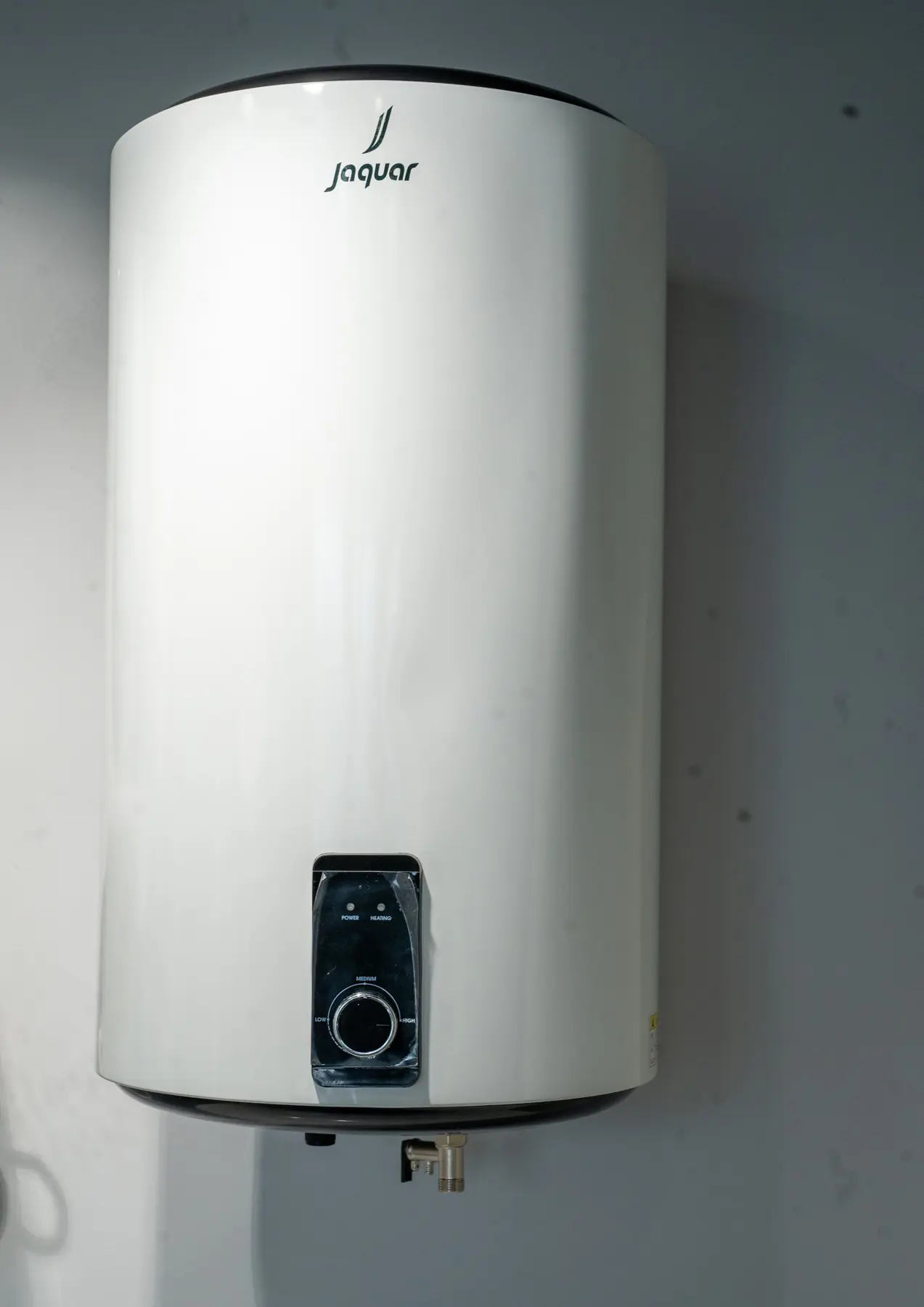 A vertical water heater with a digital control panel