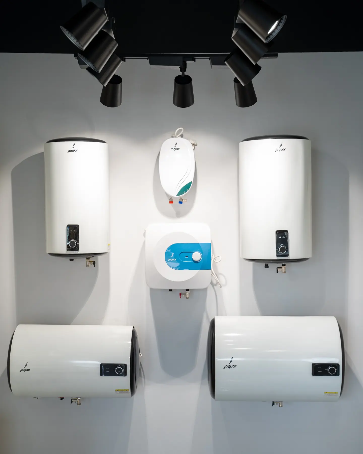 A wall of Jaquar water heaters in vertical, compact and horizontal sizes