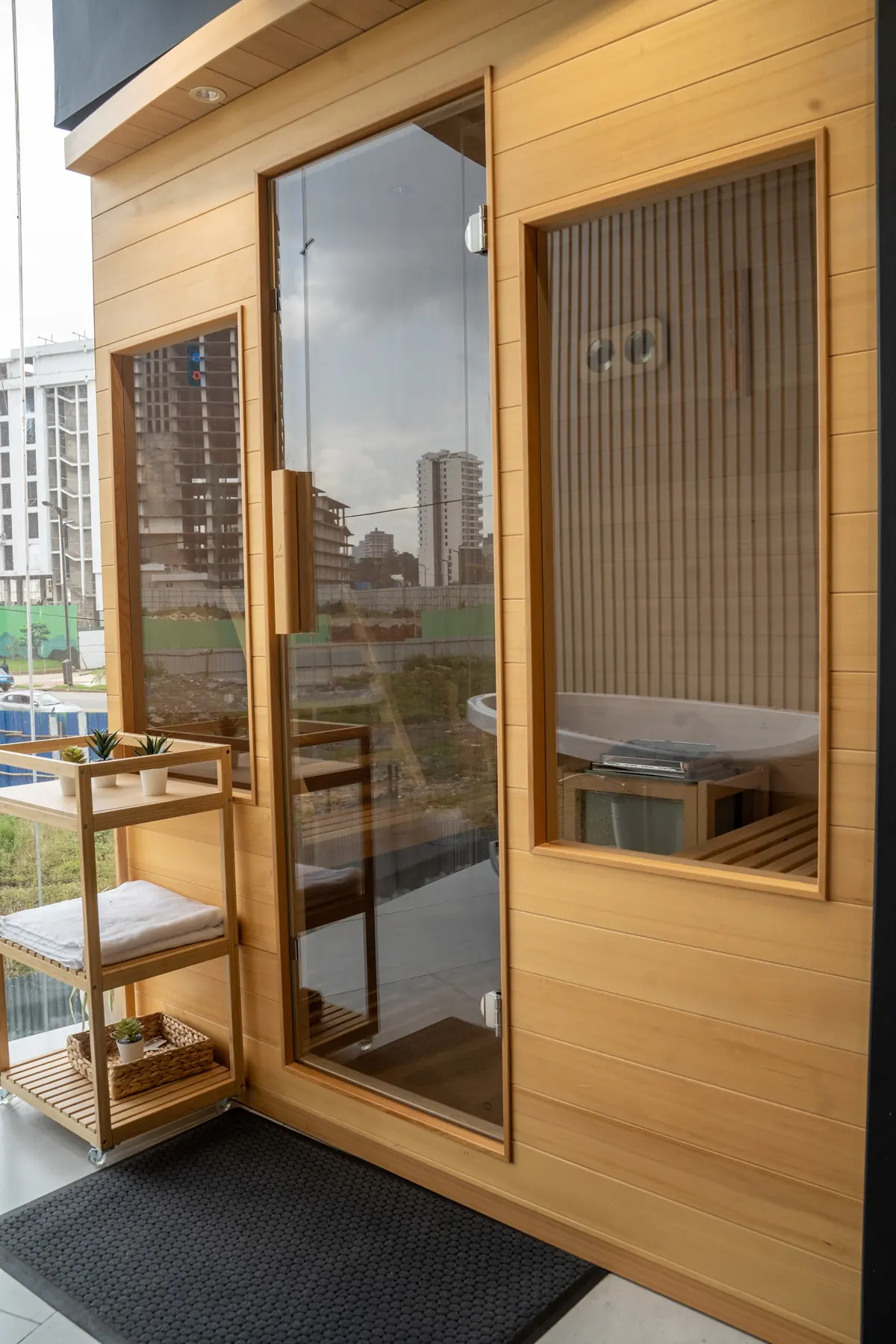 The glazed door of a wooden sauna cabin