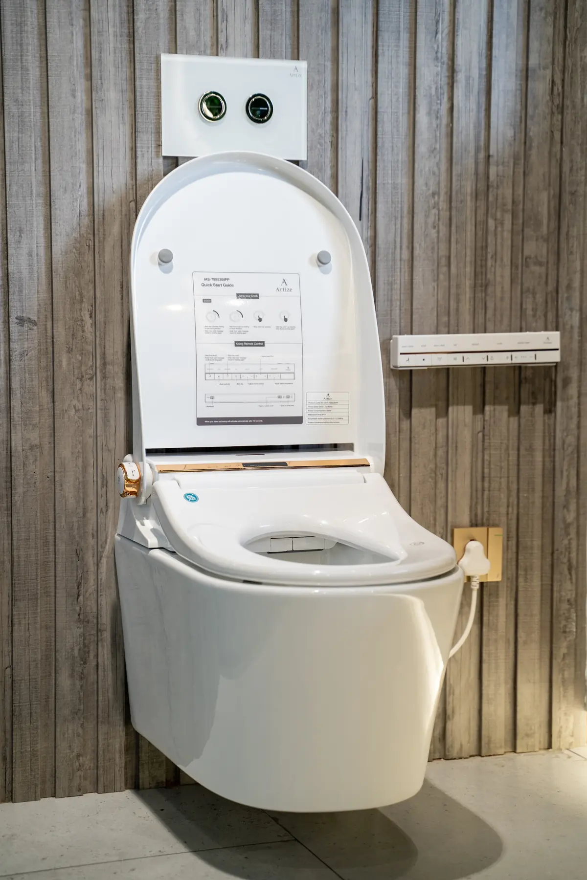 A wall-hung smart toilet with the lid open