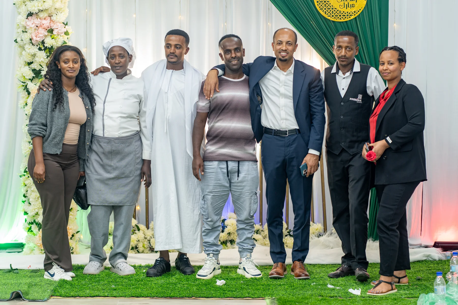 Colleagues posing together at the Iftar gathering