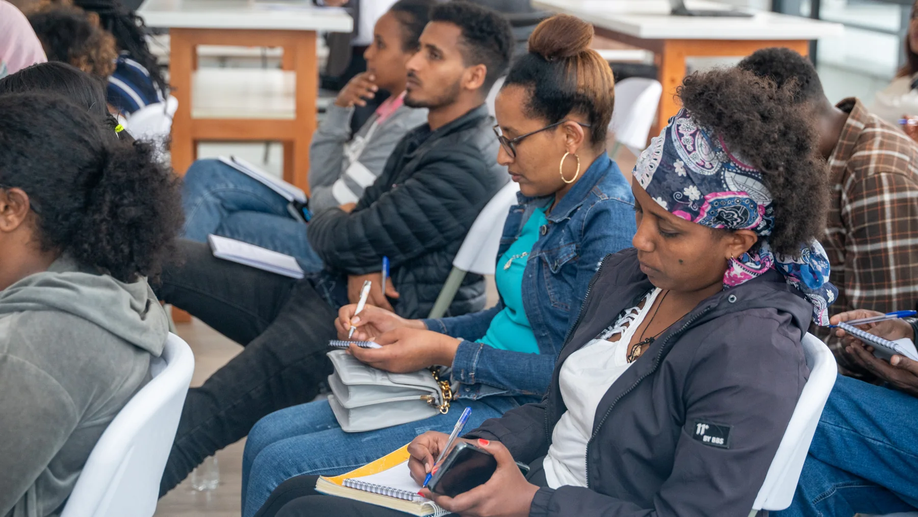 Colleagues taking notes during the staff training