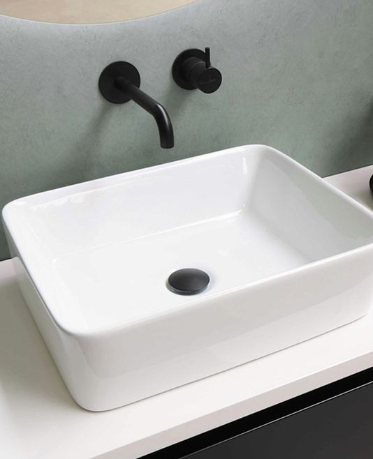 Square vessel basin with a wall-mounted matte black mixer