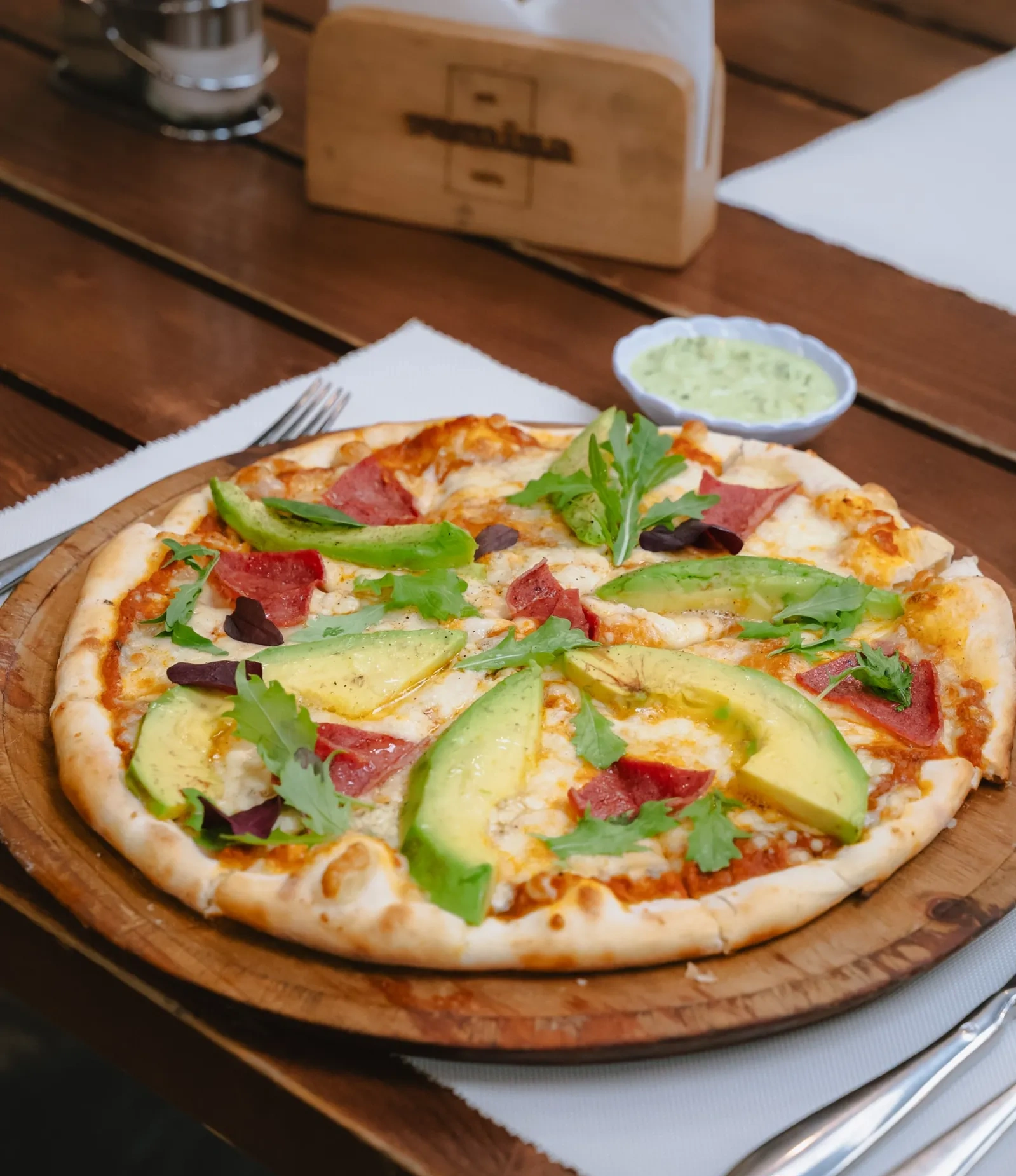 Avocado-topped pizza at Romina